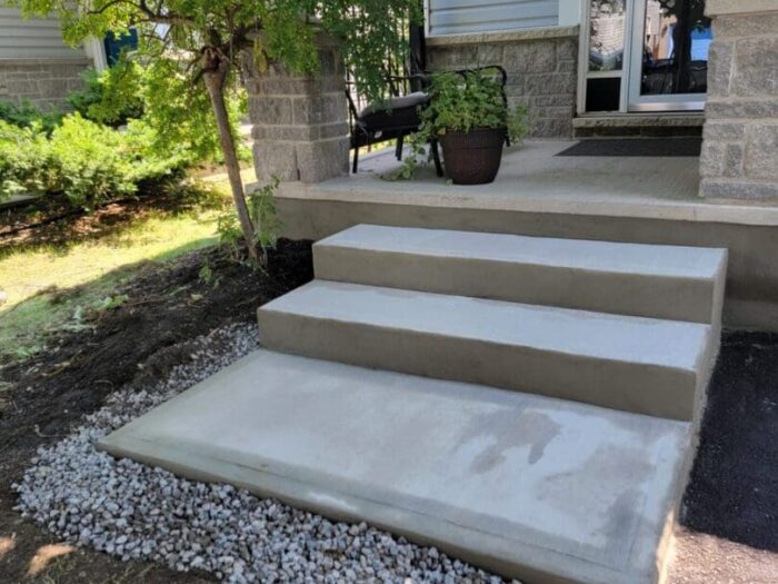 New concrete landing and step over a gravel bed