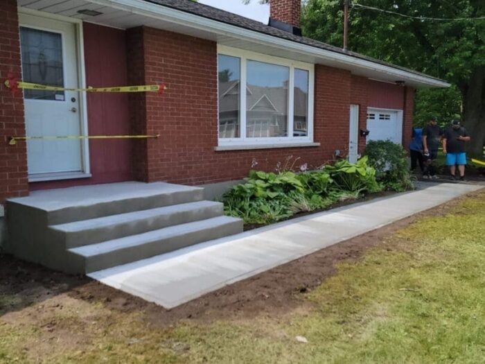 New concrete steps and walkway at a bungalow