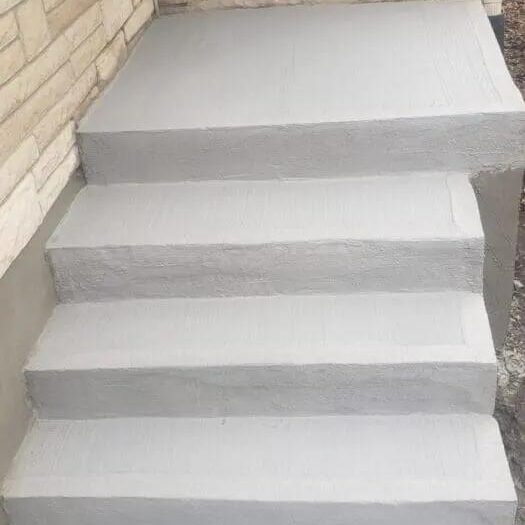 Wide concrete steps finished with a broom texture