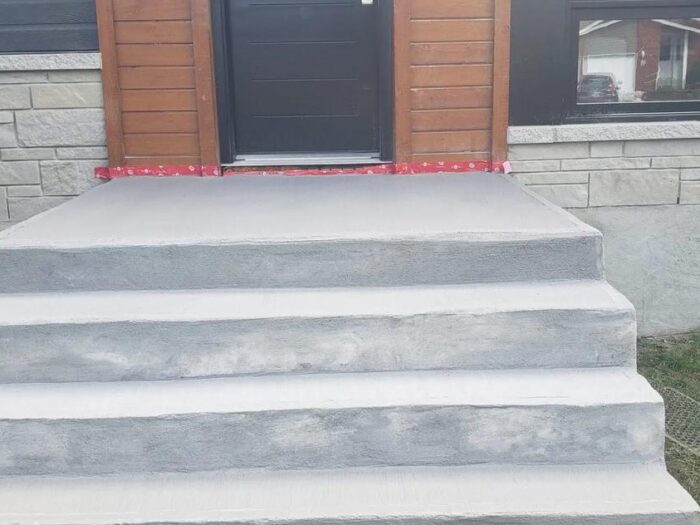 New concrete steps and landing at a front door