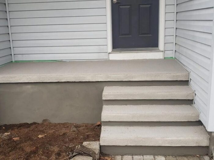 New concrete step at a side entrance