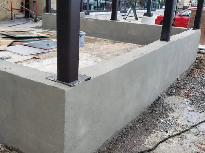 Formed concrete retaining wall