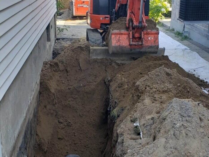 Excavation alongside a foundation for exterior waterproofing