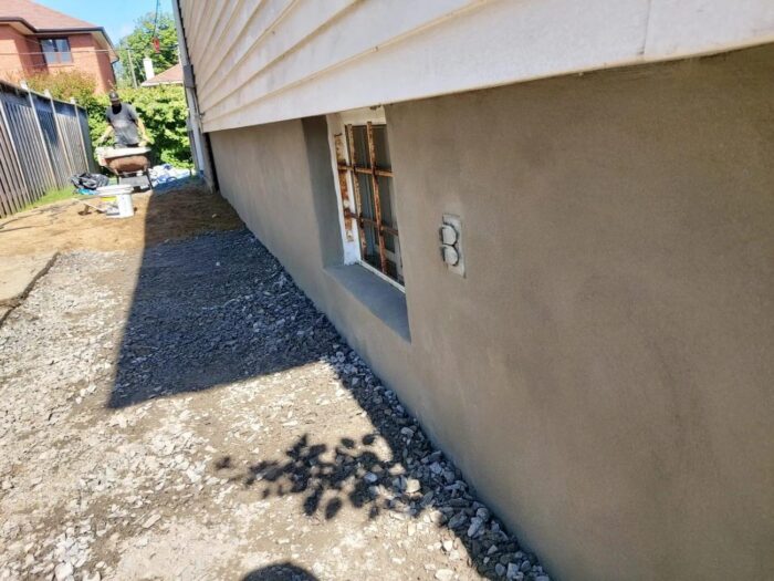 Excavated foundation wall ready for waterproofing
