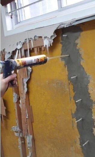 Polyurethane injected into a foundation crack through ports