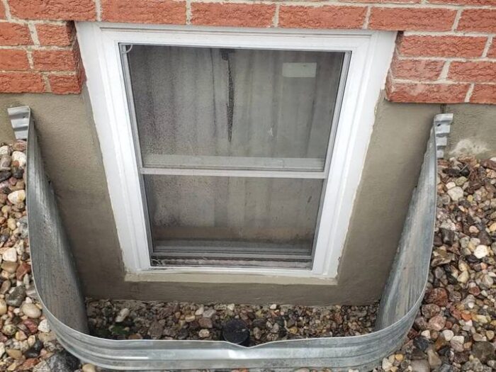 Window well and below-grade opening sealed against water