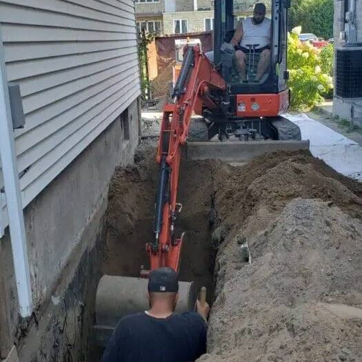 Excavating along a foundation wall for exterior waterproofing