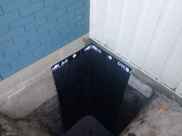 Exterior waterproofing membrane on an exposed wall