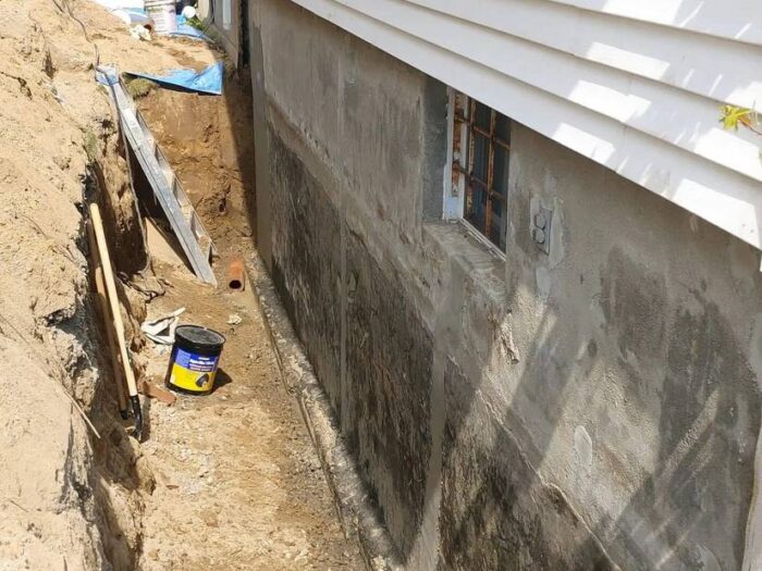 Excavation along a foundation for waterproofing