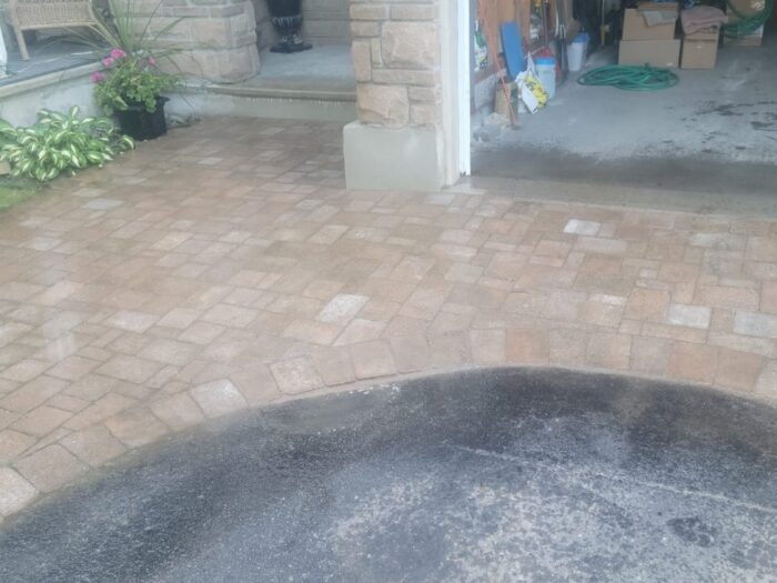 Re-levelled interlock apron at a garage door