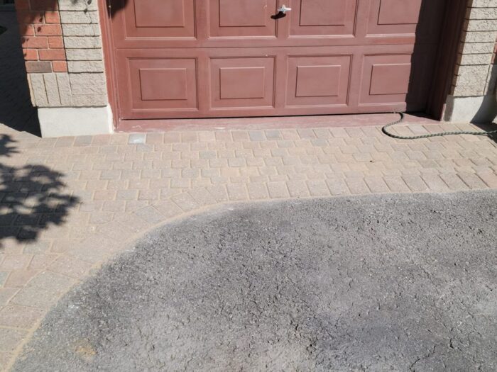 Finished interlock apron across a double garage
