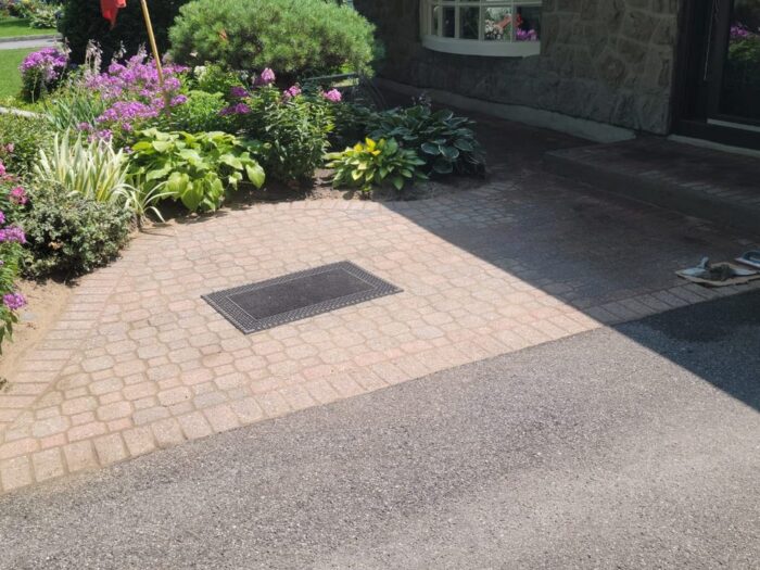 Cobble walkway and step relaid at a stone entrance