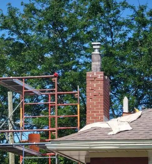 Chimney repair in progress from the roof