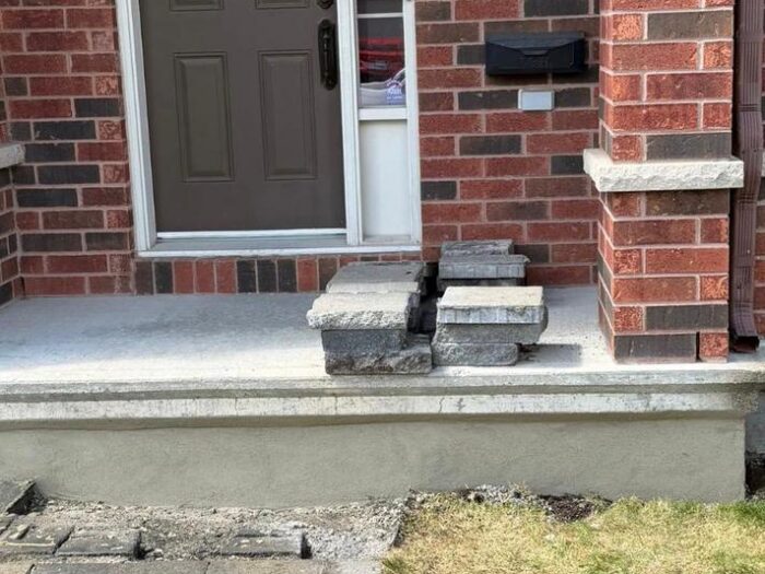 Parged foundation and porch edge at a front entrance