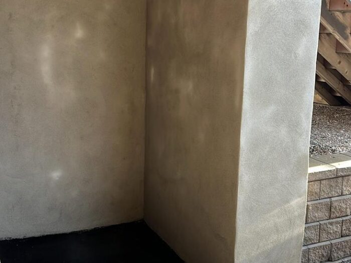 Parged walls in a garage entry alcove