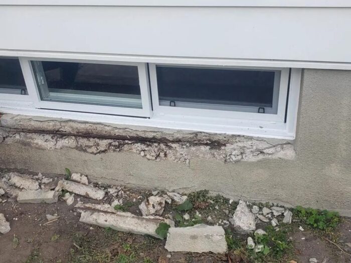 Parged wall below a basement window