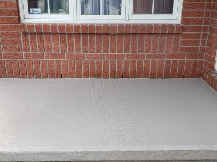 Parged foundation under brick, finished flush to the walk