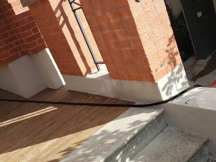 Foundation wall refinished with a fresh parging coat