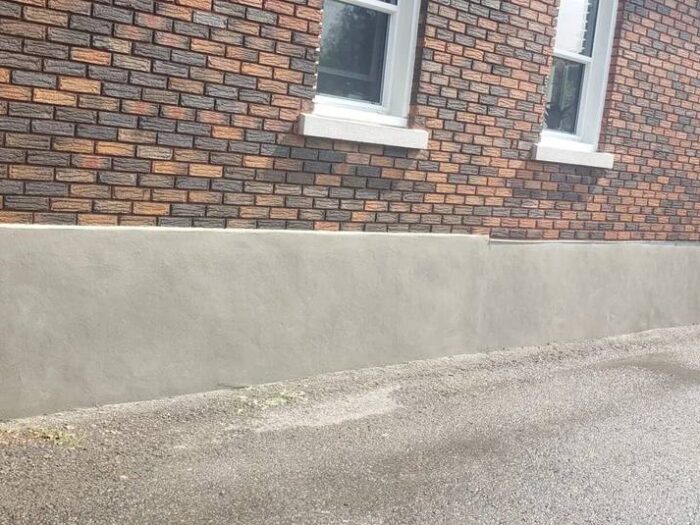 Even parging finish across a whole elevation