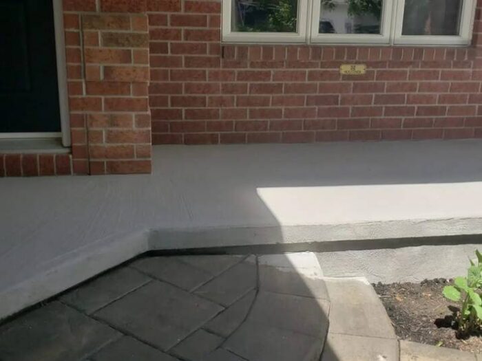 Parged foundation beside a garden bed