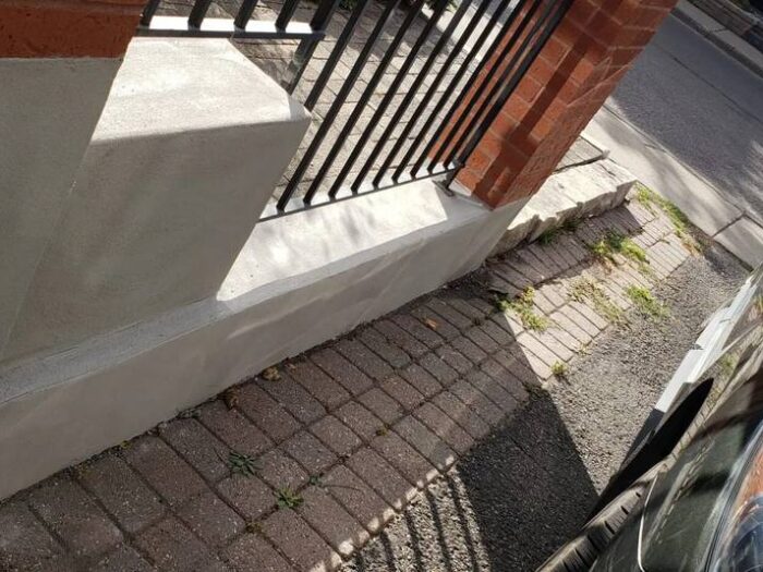 Parging finished flush to the walkway
