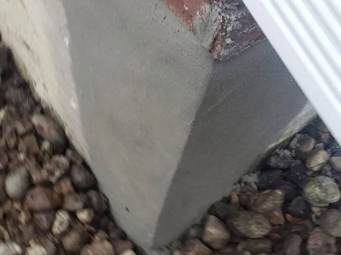 Foundation wall refinished with a fresh parging coat