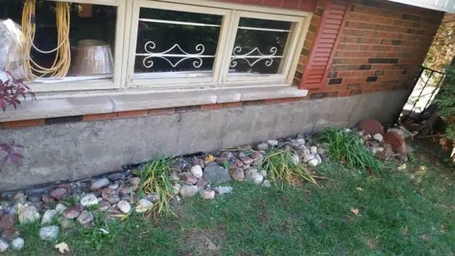 Finished parging along the exposed foundation of an Ottawa home