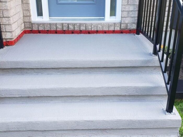 Resurfaced front steps and landing on an Ottawa home