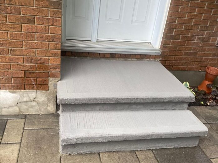 Resurfaced steps and landing seen from the walkway