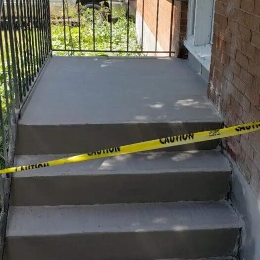 Resurfaced steps taped off while curing