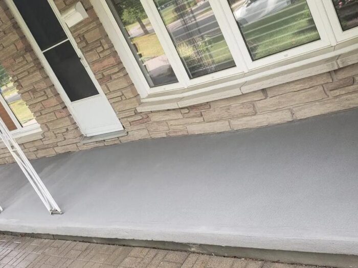 Resurfaced concrete under a bay window