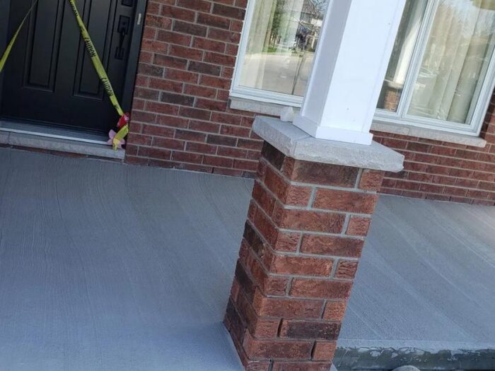 Resurfaced porch floor and brick pillar base