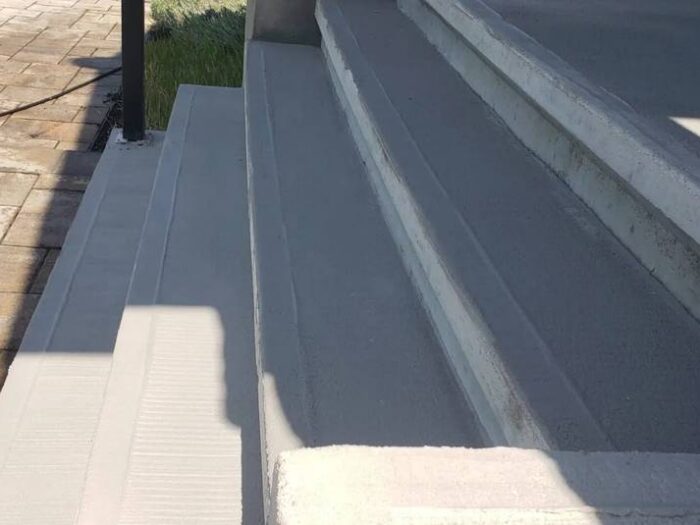 Resurfaced walkway leading to a front door