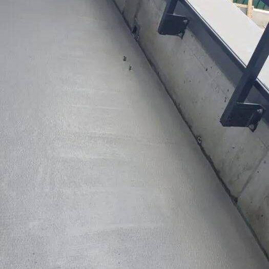 Resurfaced landing and step at an entrance