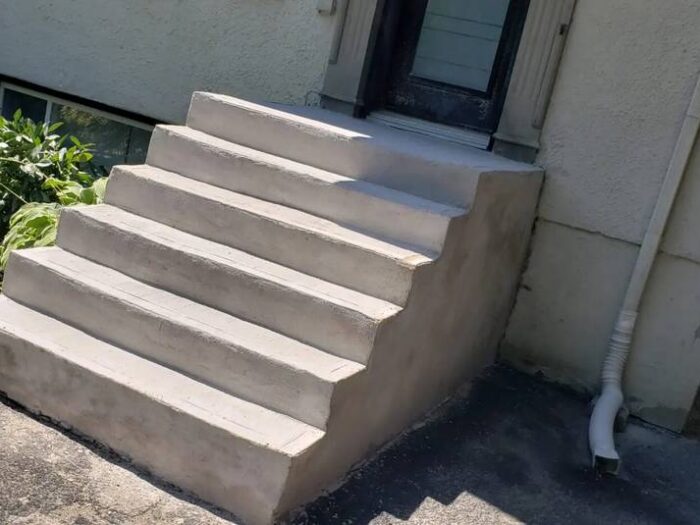 Resurfaced walkway leading to a front door