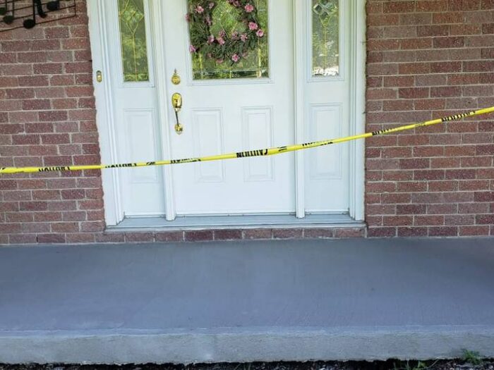 Resurfaced walkway leading to a front door