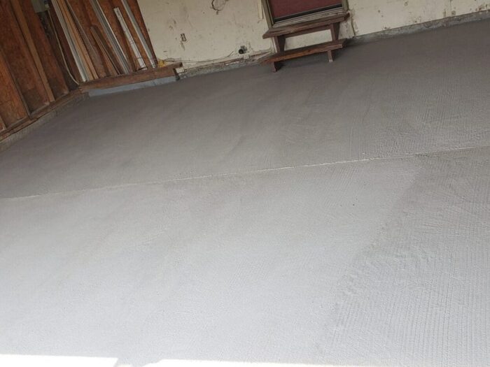 Resurfaced garage floor across the full bay