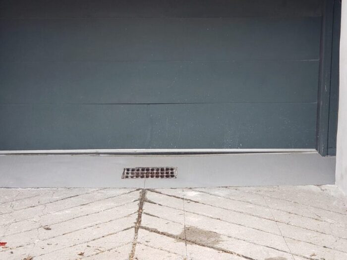 Resurfaced garage apron at the door line
