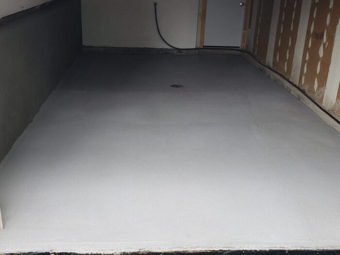 Resurfaced garage floor seen from the driveway