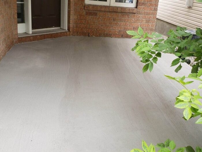 Resurfaced porch landing beside the front door